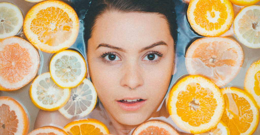 woman in a spa with oranges
