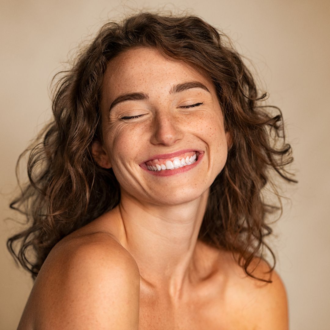 Freckled woman smiling
