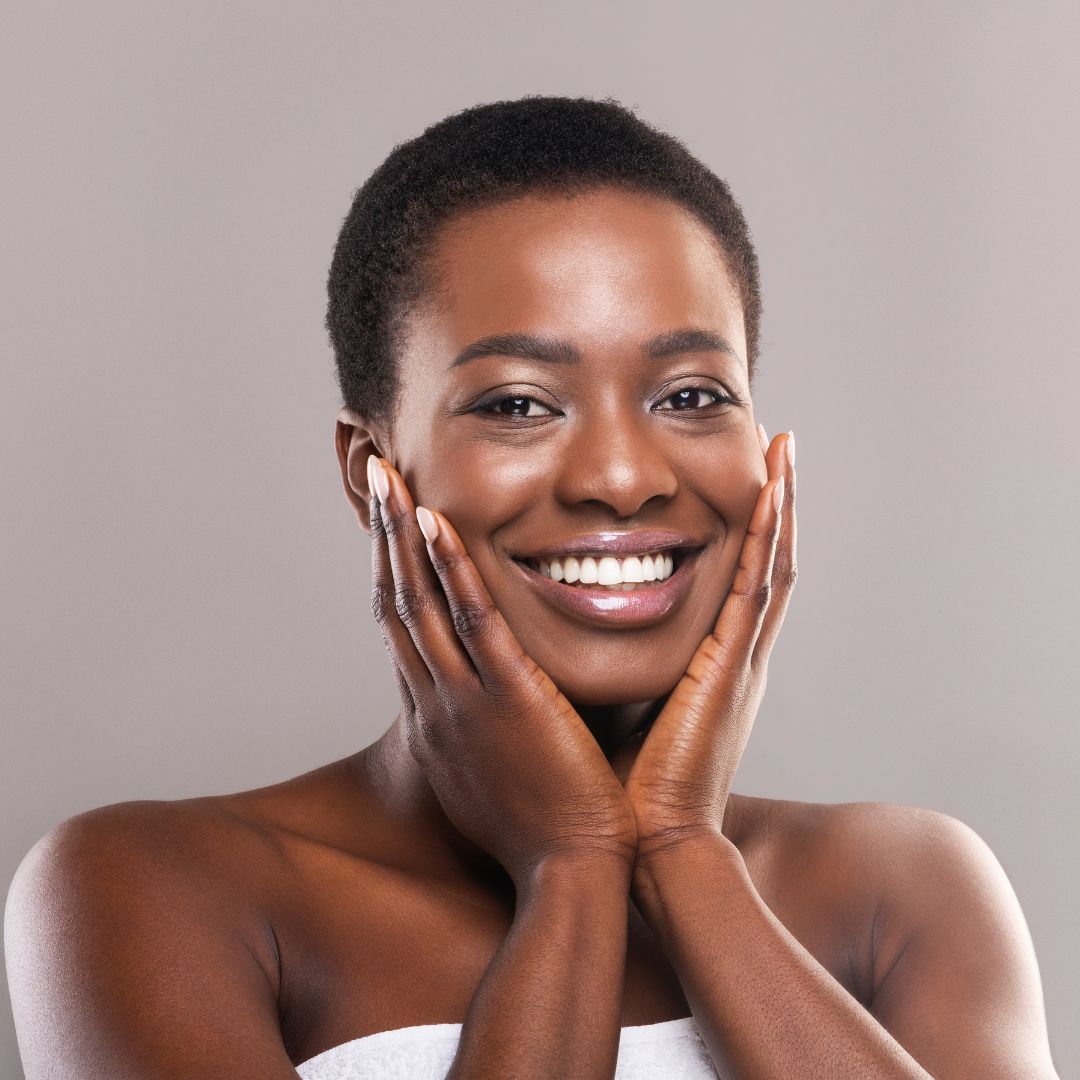 Smiling woman enjoying her youthful glow