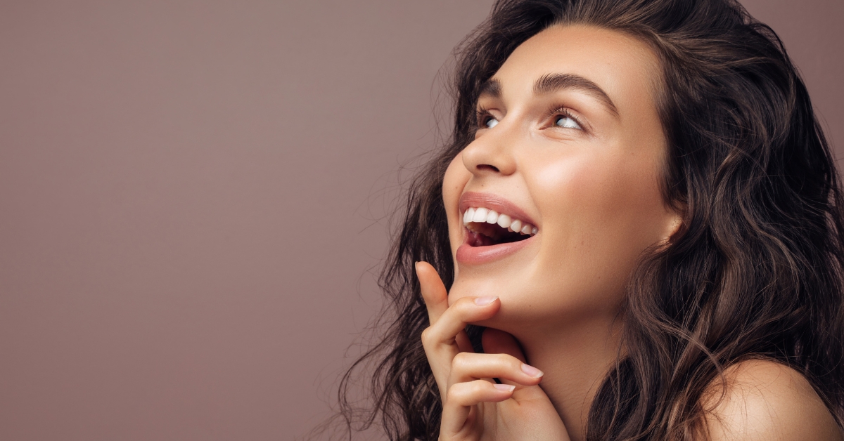 woman's profile of her face as she's smiling