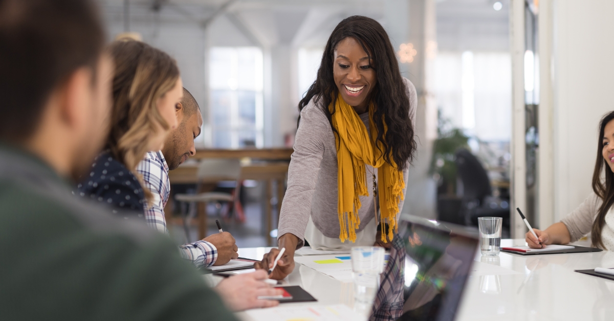 woman directing a business meeting