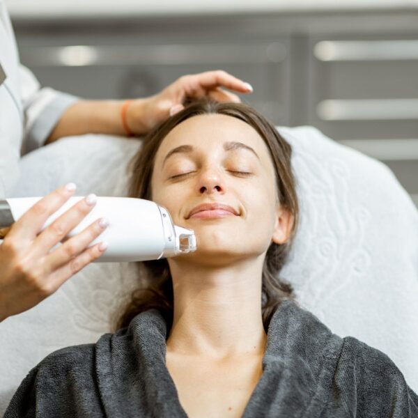 Skincare specialist performing a skincare treatment