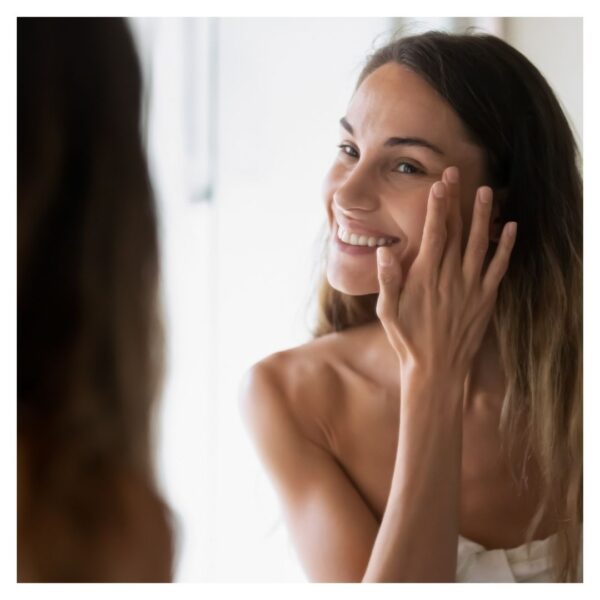 woman looking in mirror