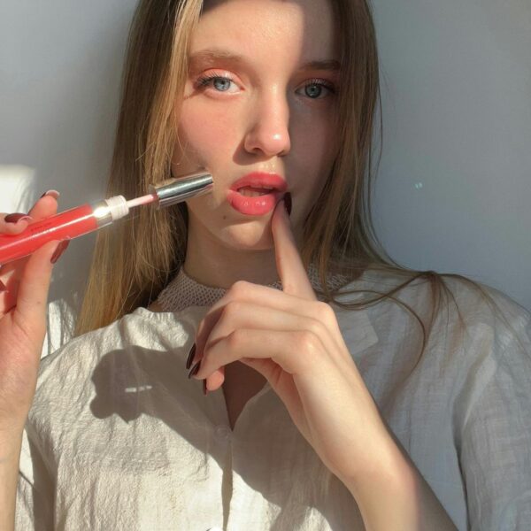Applying lip gloss